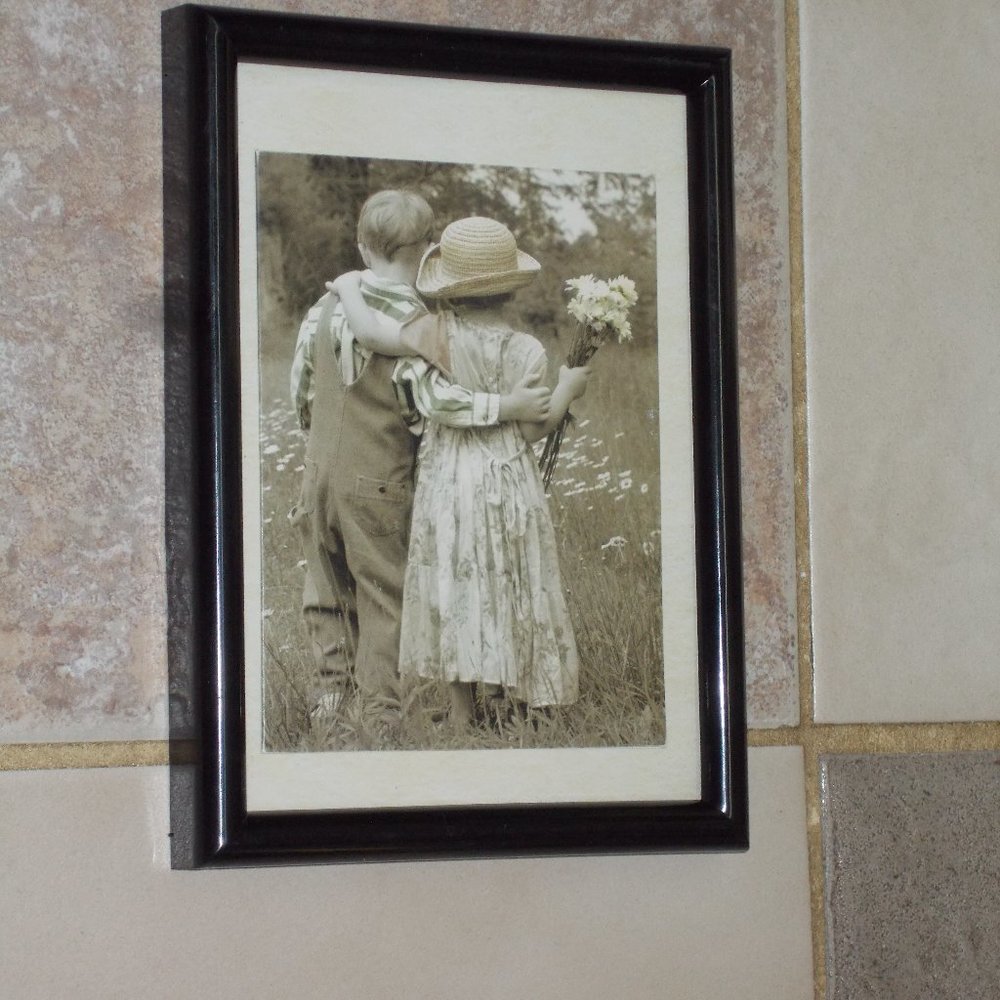 Precious young boy & girl print walking together in the field, framed